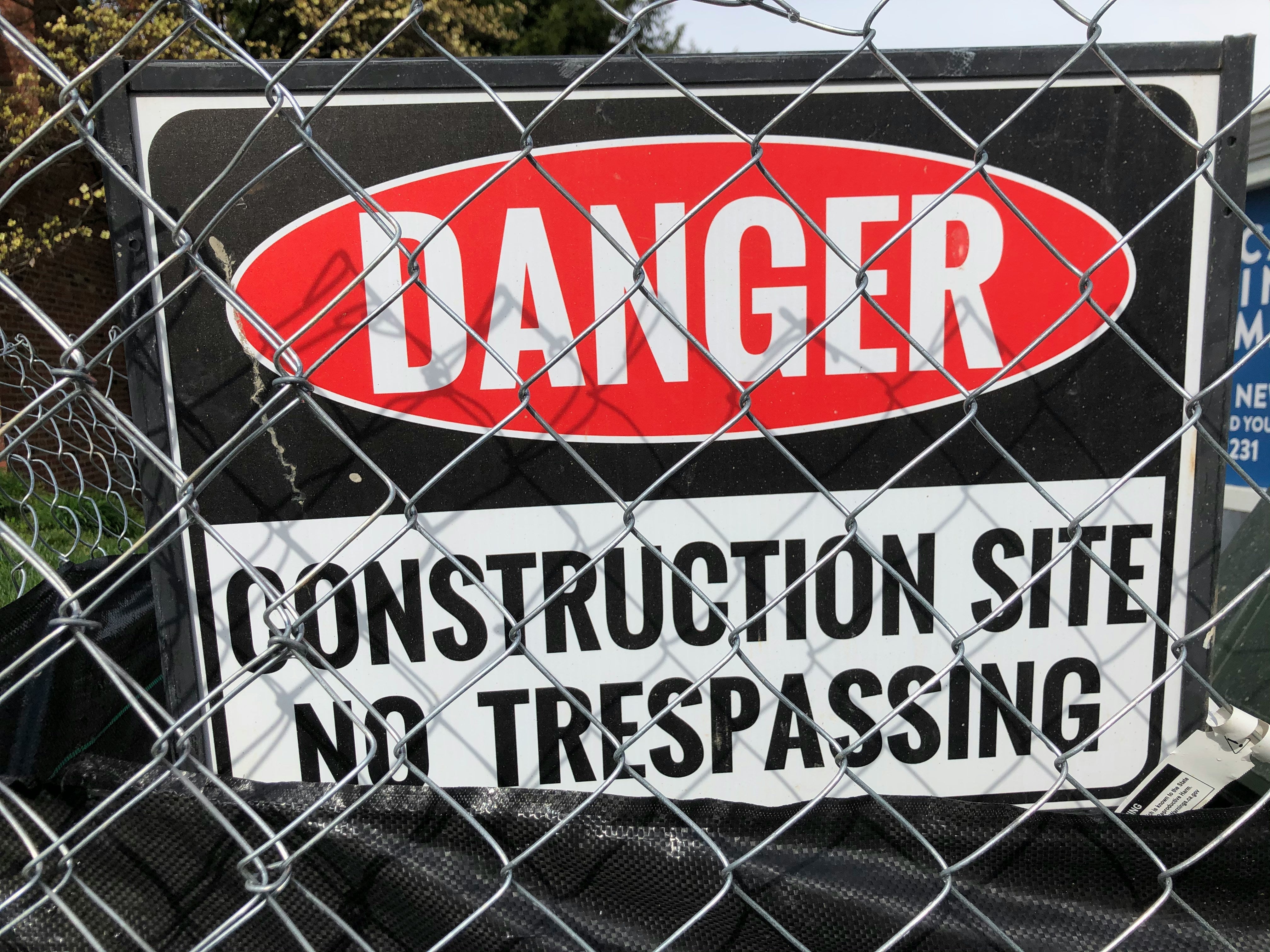 Why are safety signs so important for construction sites?
